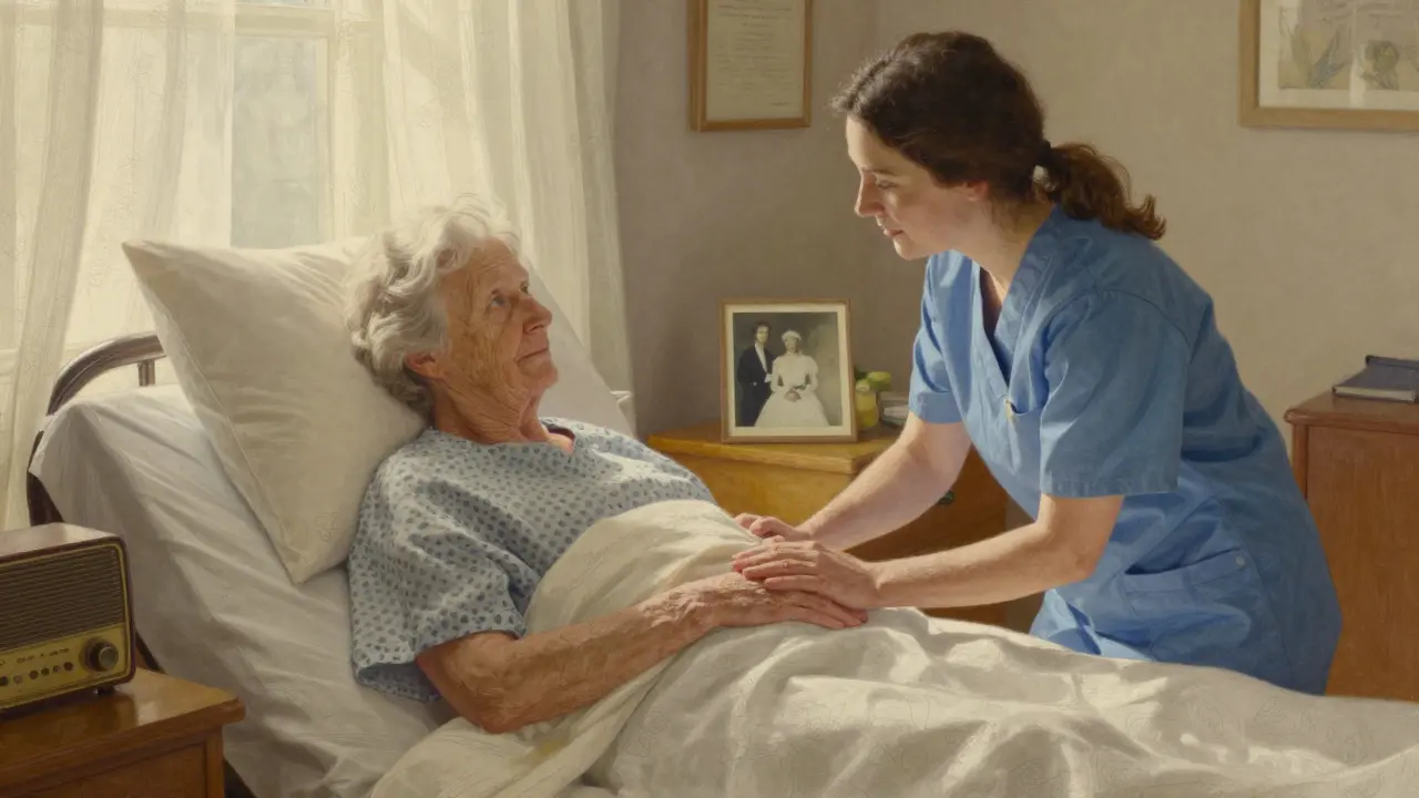 A caregiver gently holds the hand of a bedridden woman, sunlight streaming in as a wedding photo rests nearby.